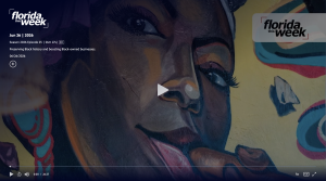 Screenshot of a news video tile that features a painting of a woman's face.